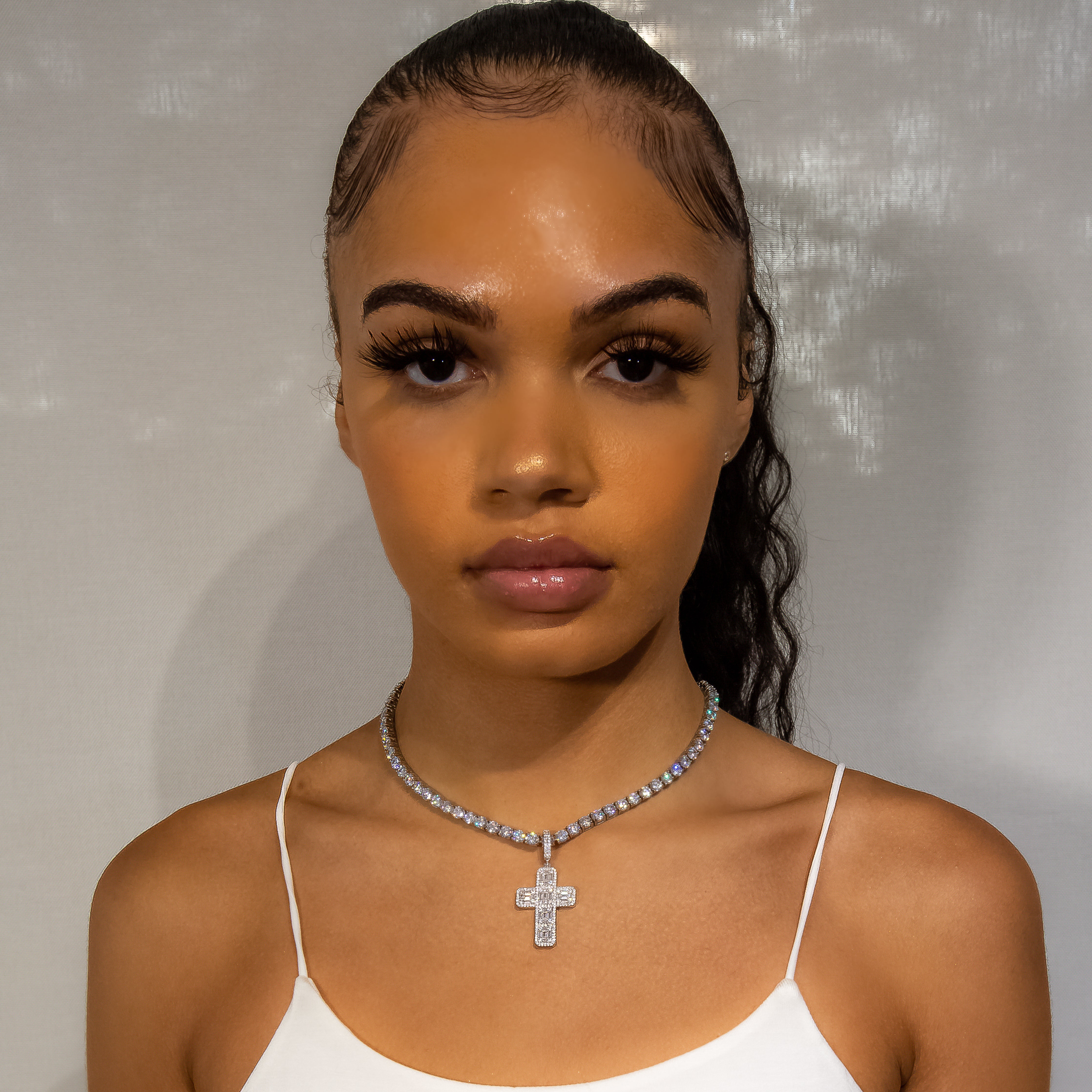 Iced Out Baguette Diamond Cross in White Gold (view 2 of 7) · female-model