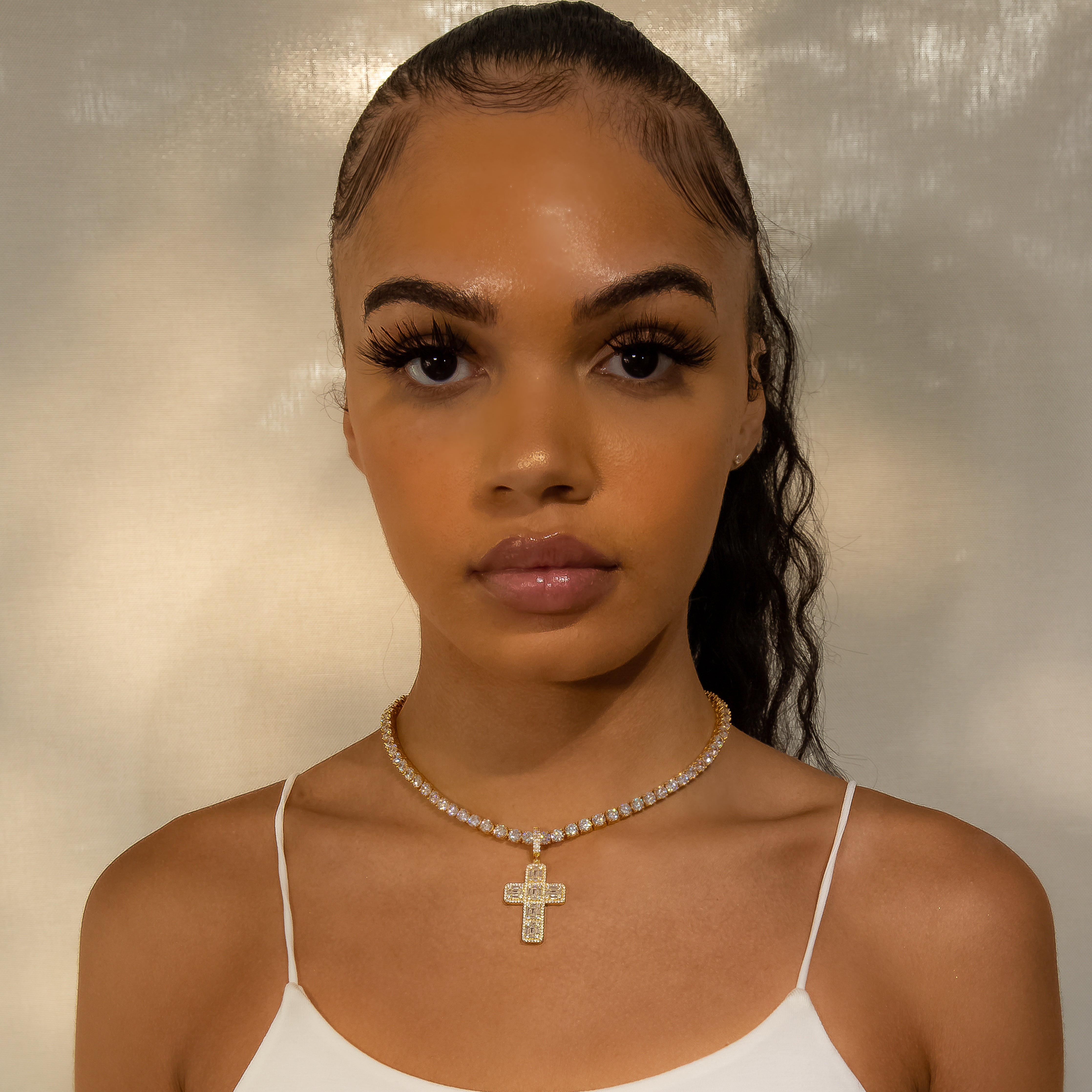 Iced Baguette Diamond Cross in Yellow Gold (view 4 of 6) · female-model