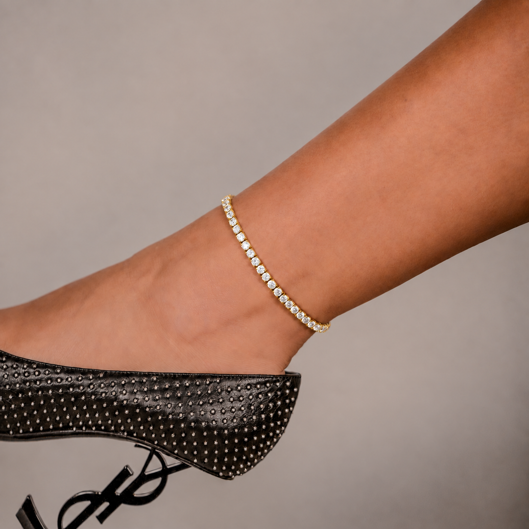 SKRT 3mm Tennis Anklet in Yellow Gold shown on an ankle.