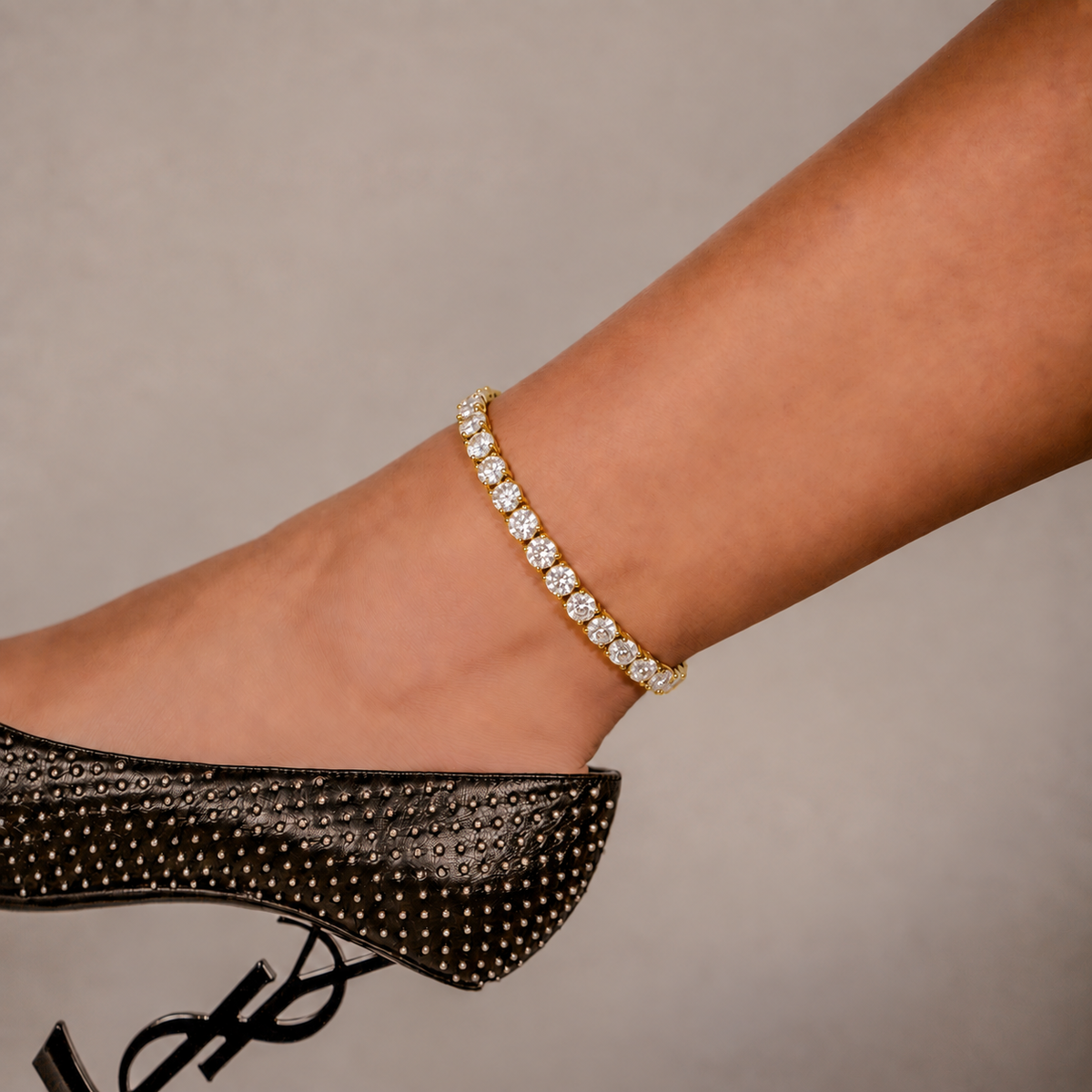 SKRT 6mm Tennis Anklet in Yellow Gold shown on an ankle.