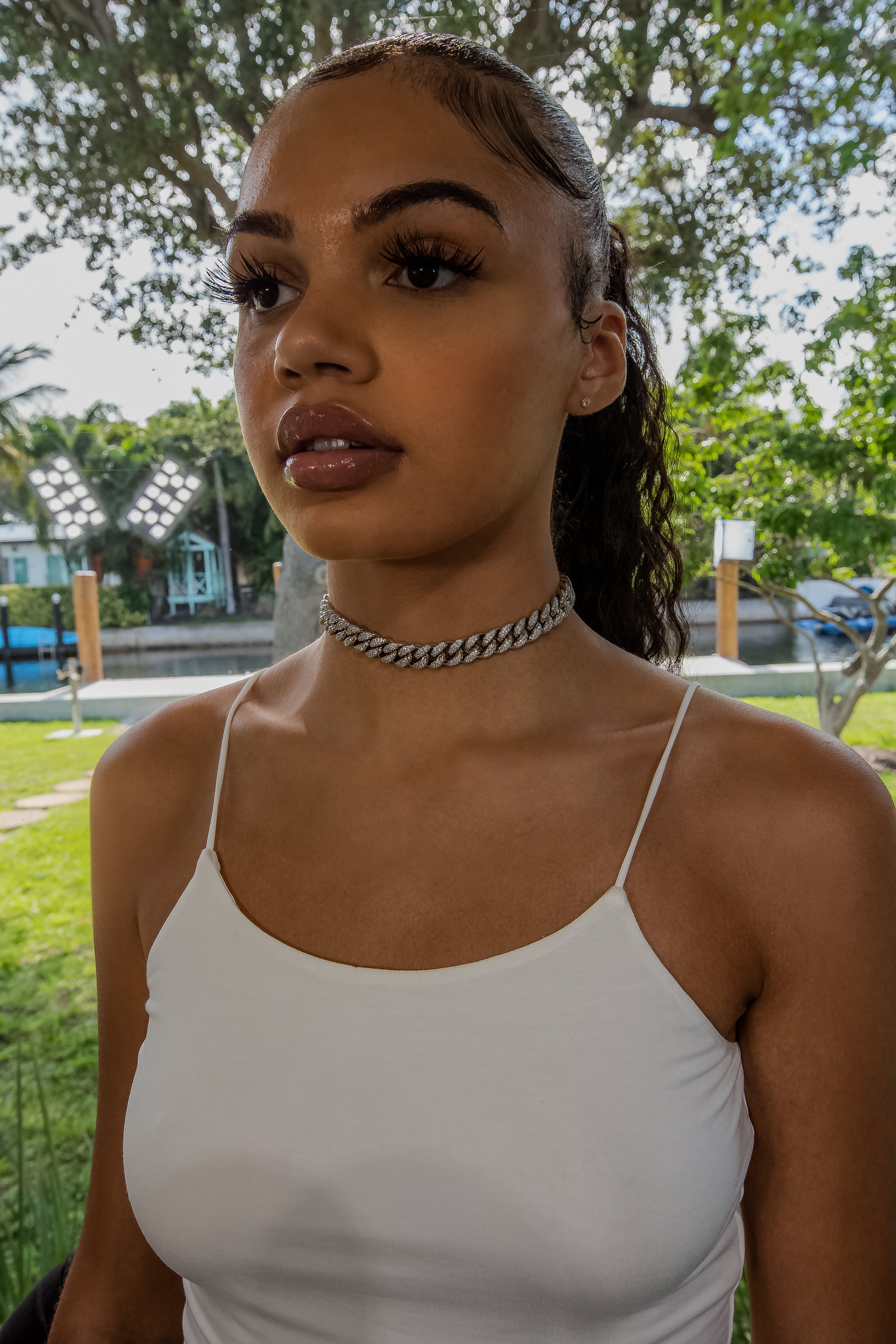 12mm Cuban Link Choker on model - 18K White Gold (side angle) · female-model