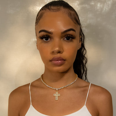 Iced Baguette Diamond Cross in Yellow Gold (view 4 of 6) · female-model