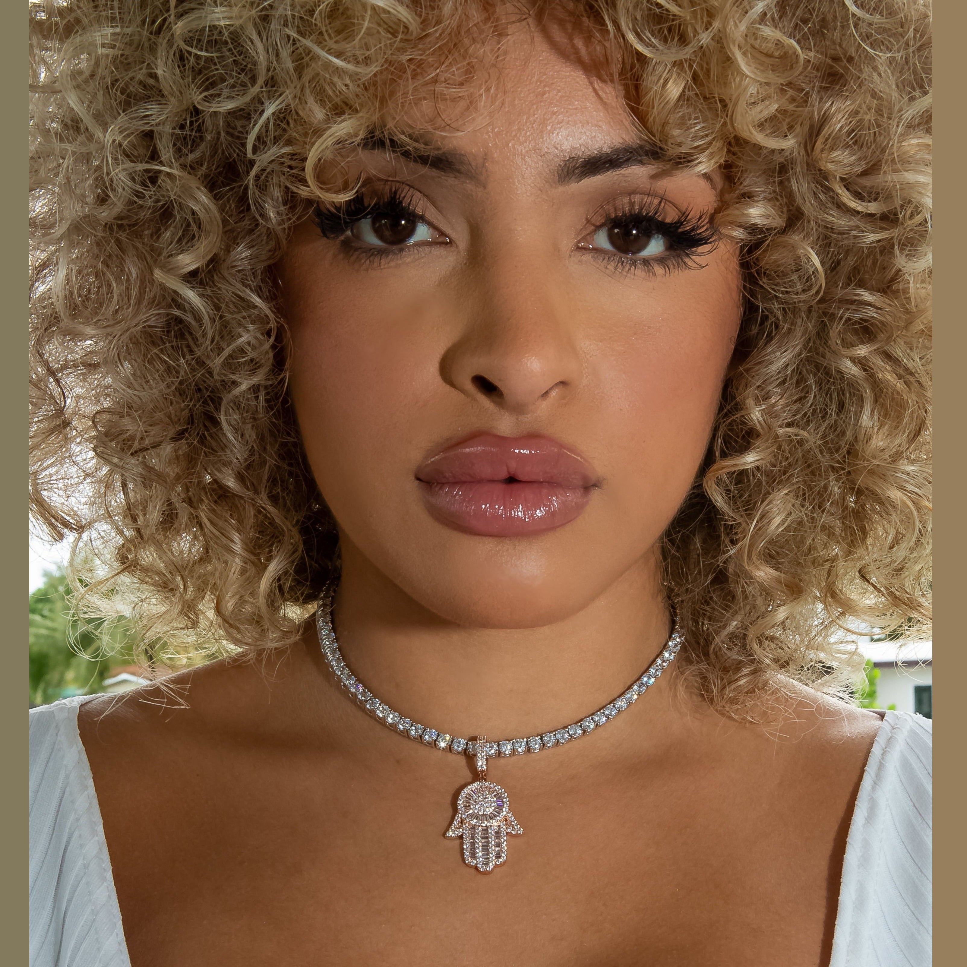 Diamond Baguette Hamsa Hand in 18K Rose Gold - product image · female-model