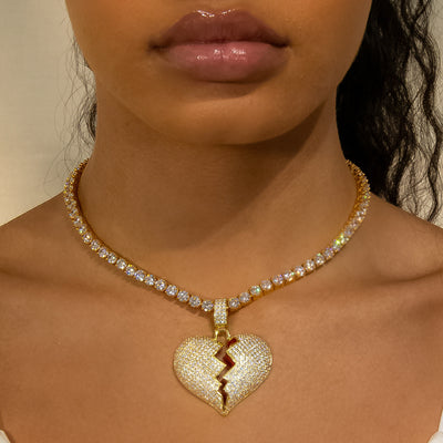 Iced Diamond Broken Heart In Yellow Gold (view 3 of 7) · female-model