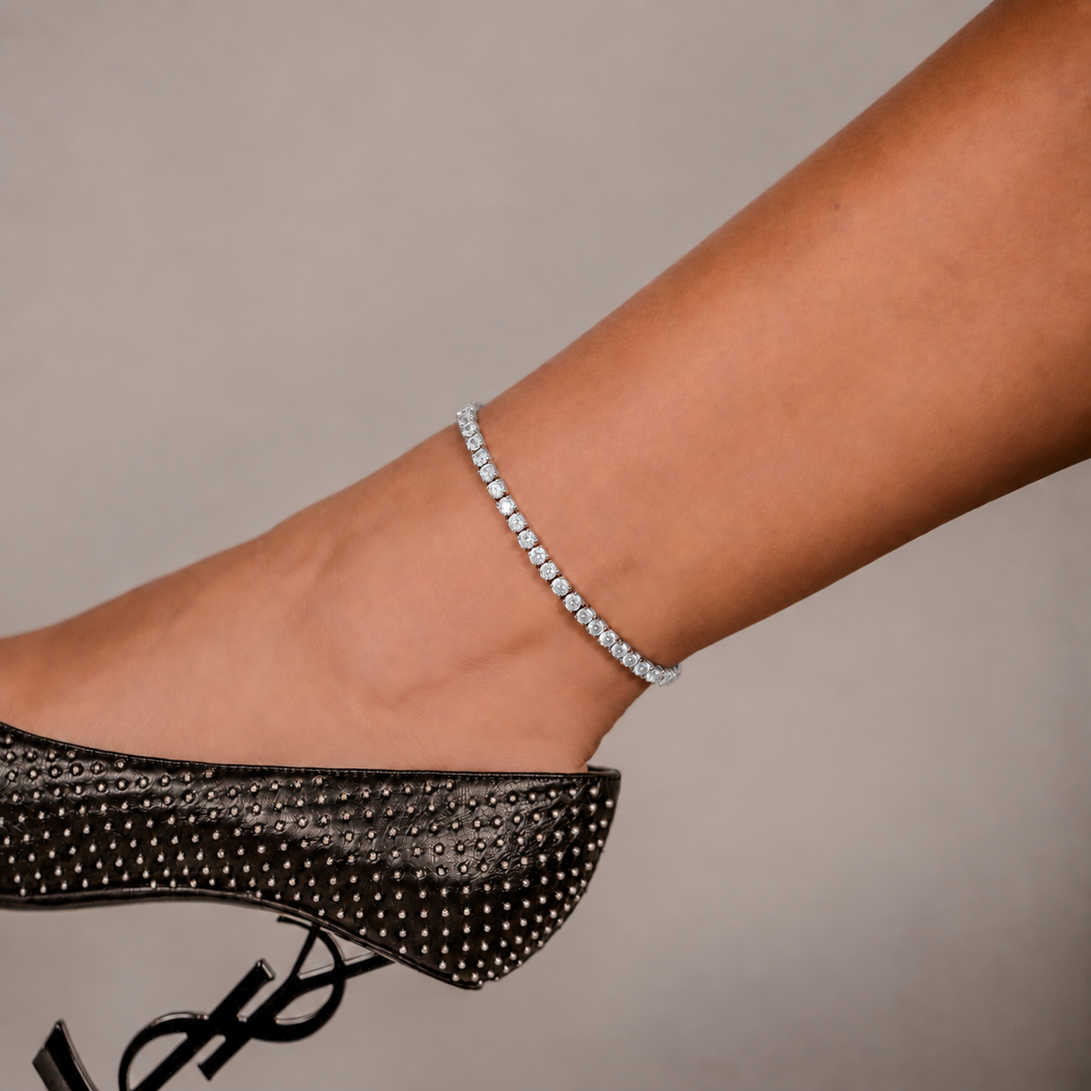 SKRT 3mm Tennis Anklet in White Gold shown on an ankle.