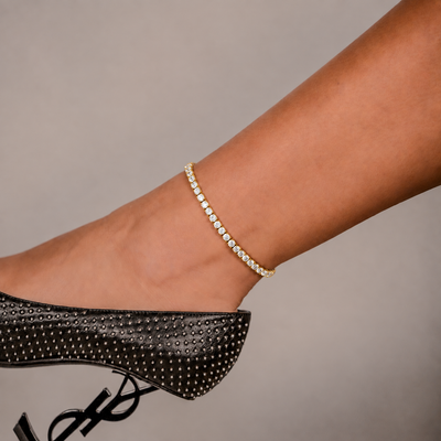 SKRT 3mm Tennis Anklet in Yellow Gold shown on an ankle.