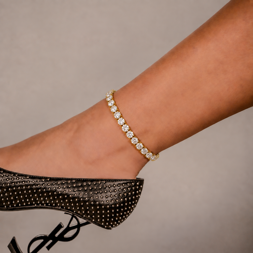 SKRT 6mm Tennis Anklet in Yellow Gold shown on an ankle.