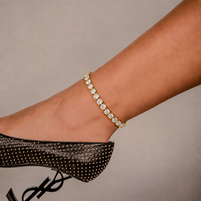SKRT 6mm Tennis Anklet in Yellow Gold shown on an ankle.